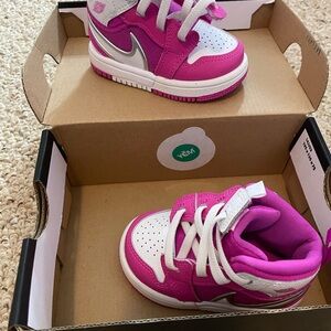 Kids Pink and White Nike Jordan’s